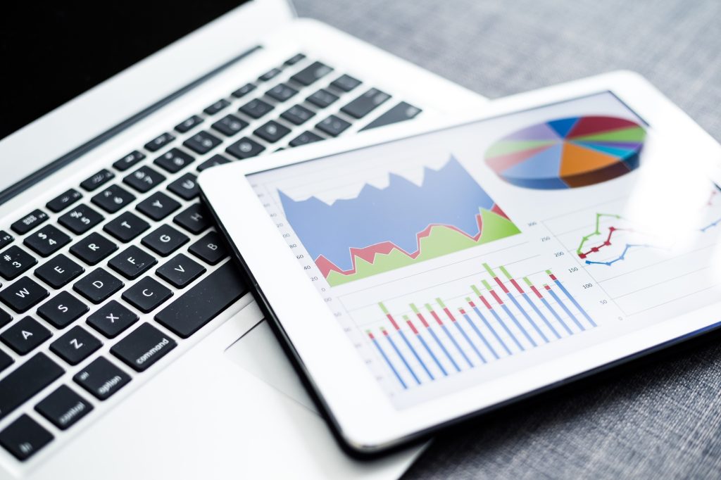 Business charts and diagrams on digital tablet